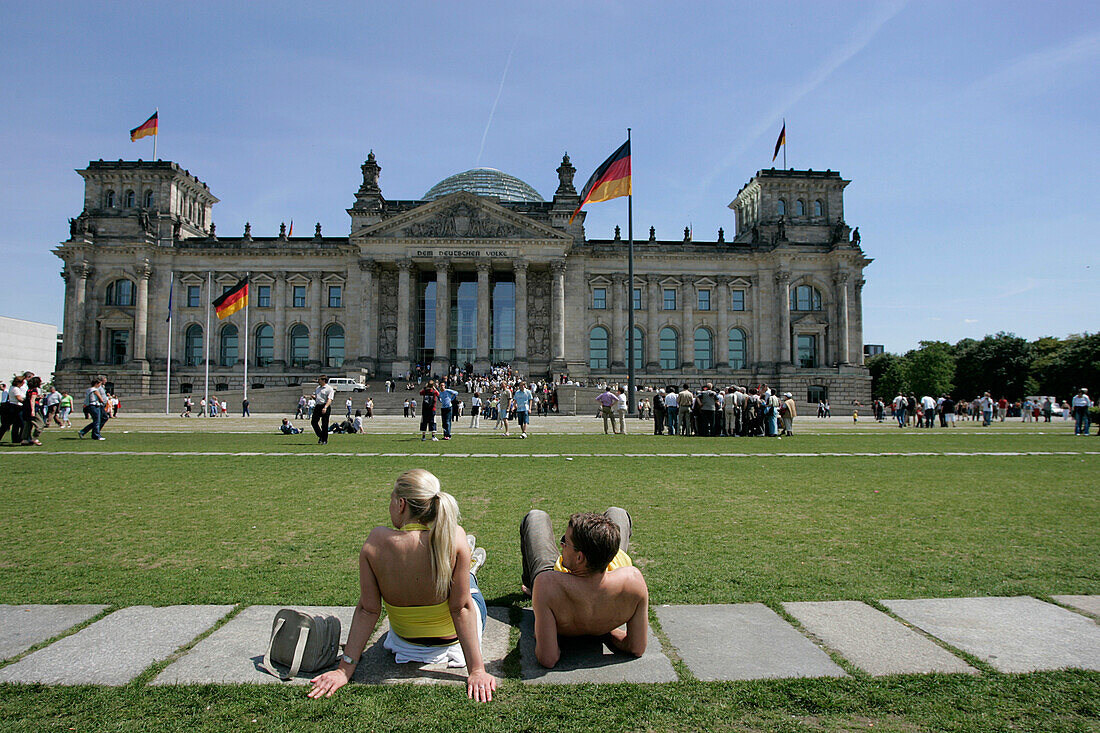 Young people in front of German Reichstag, Berlin, Germany