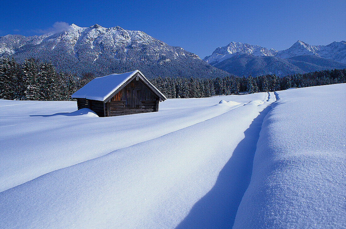 Hut in snow, Werdenfelser Land, Bavaria, Germany