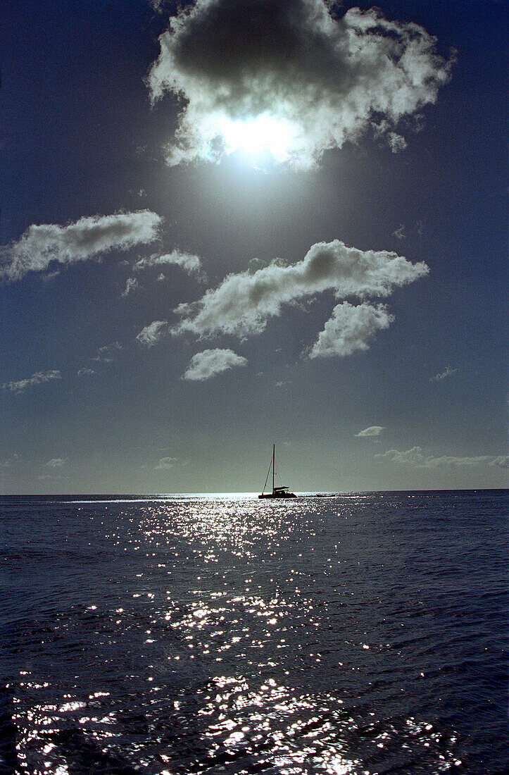 Sailing boat on the ocean in backlight, St. Lucia, Caribbean