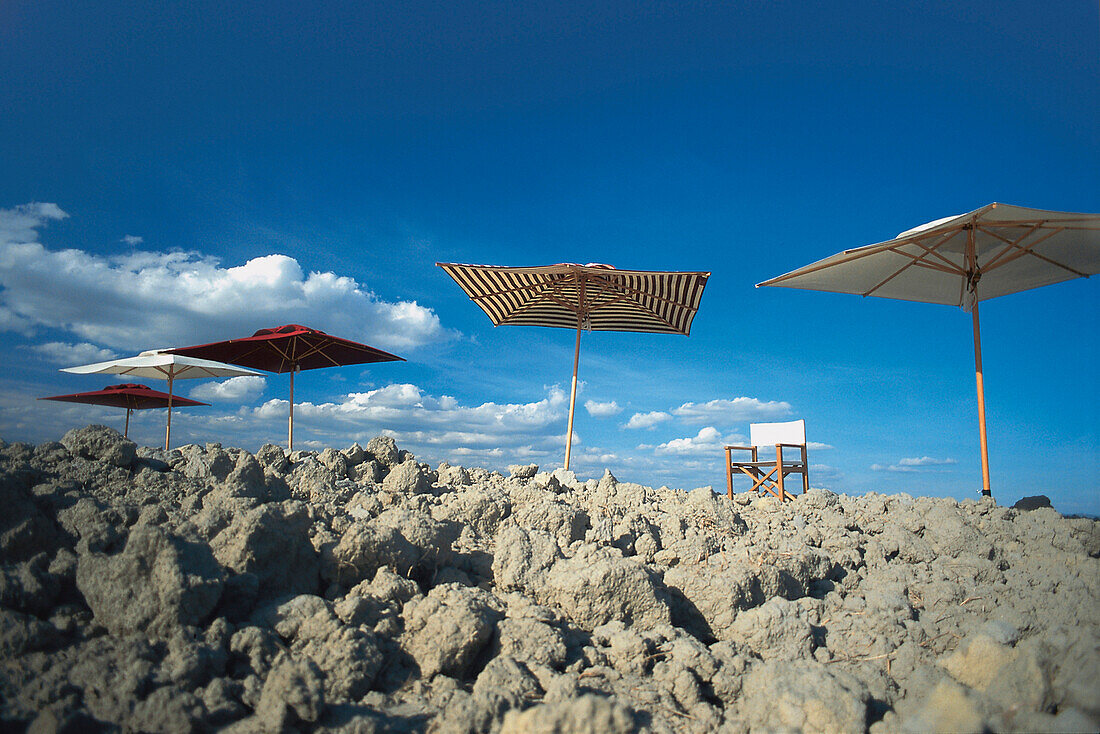 Angular sunshades and chair in front of blue sky, Tuscany, Italy