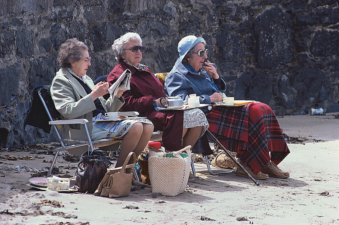 Old women at the beach, Porthmadog, Wales, United Kingdom