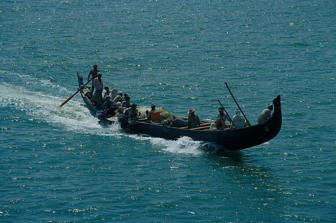 People on a long boat, Kerala India