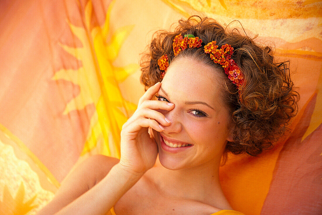 Woman on hammock smiling on camera