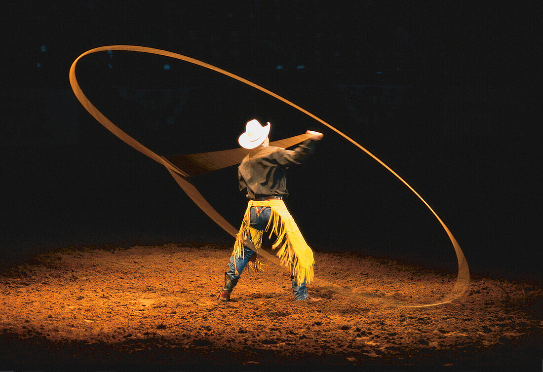 Cowboy swinging a lasso at a rodeo, Fort Worth, Texas, USA