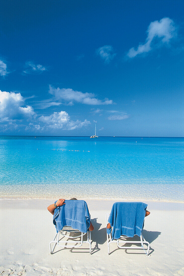 Deck chairs on Seven Mile Beach, Grand Cayman, Cayman Islands, Caribbean