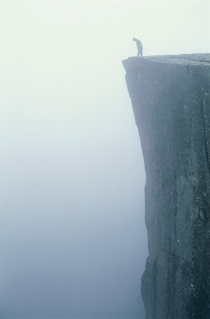 Person standing on a precipice, Stavanger Rogaland, Norway