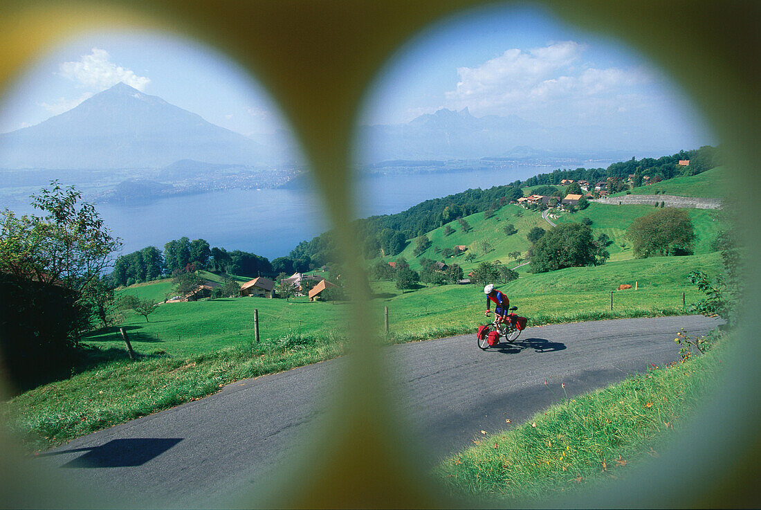 Man biking at Lake Thun, Bernese Overland, Switzerland