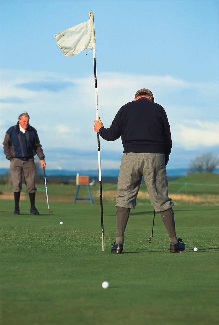 Two men playing golf, St. Andrews, Scotland, Great Britain, Europe