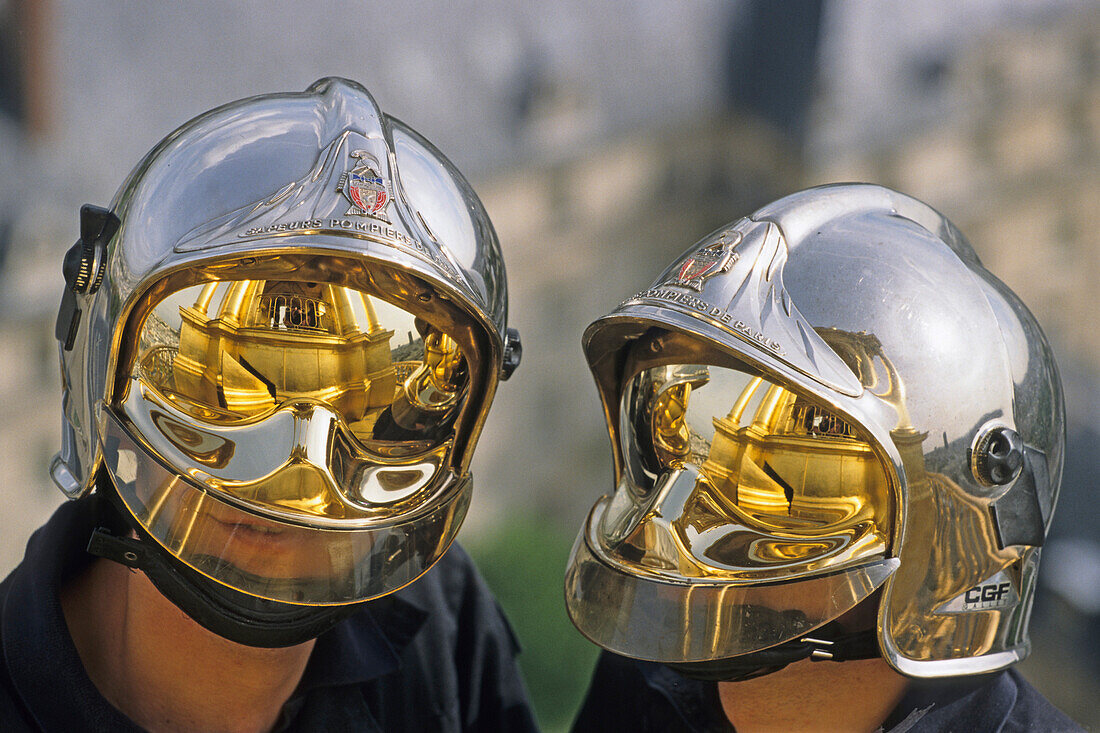 Two firemen wearing futuristic helmets, Paris, France