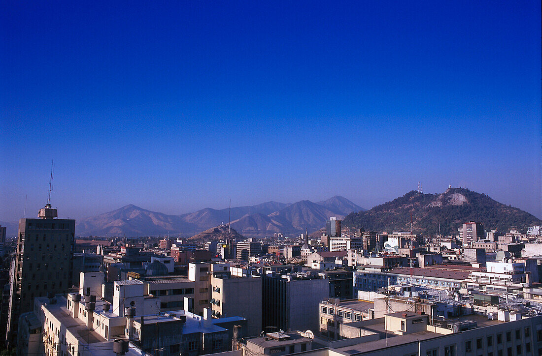 View at houses and mountains under blue sky, Santiago, Chile, South America, America