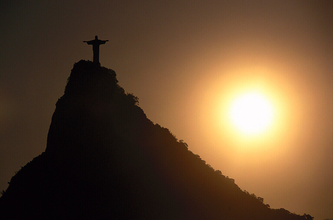 Backlit statue of Jesus Christ on Corcovado mountain, Rio de Janeiro, Brazil, South America, America