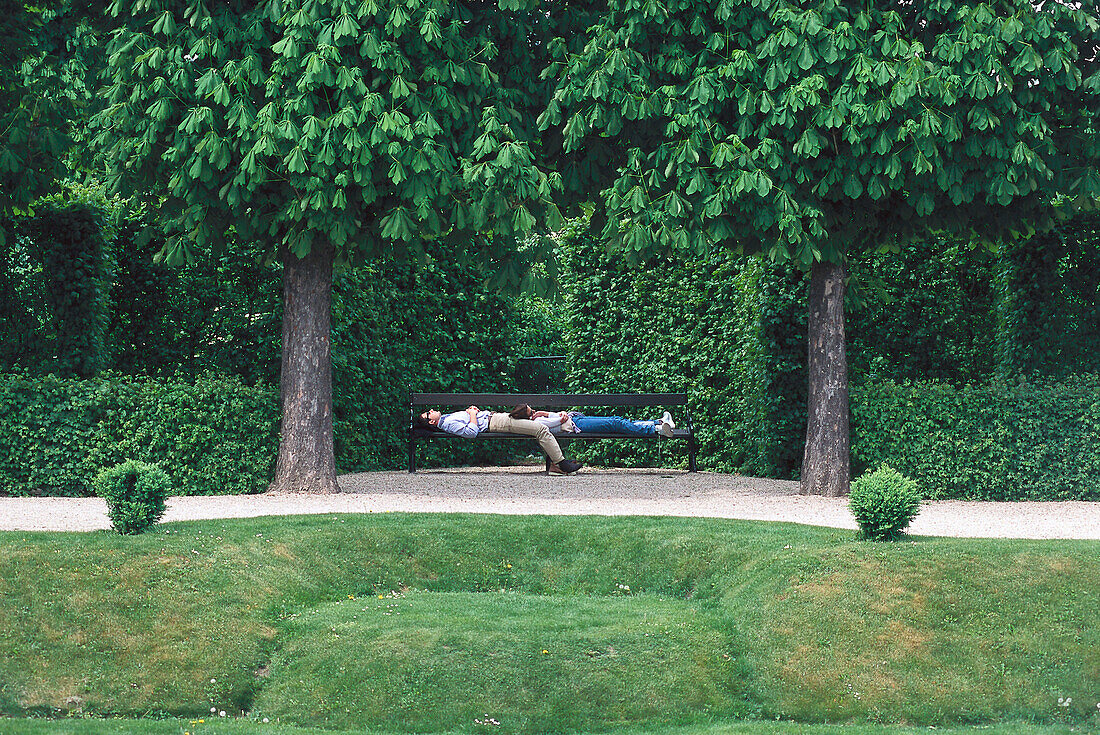 Couple relaxing in Belvedere Garden, Vienna, Austria