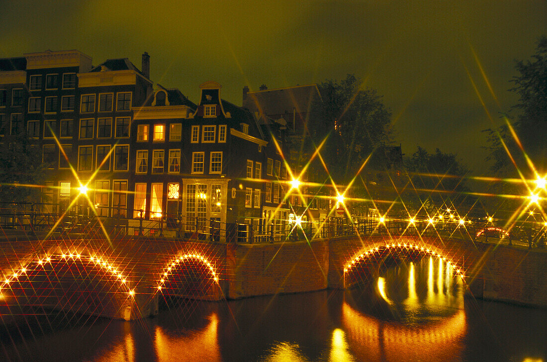 Lighted night canals, Amsterdam Netherlands