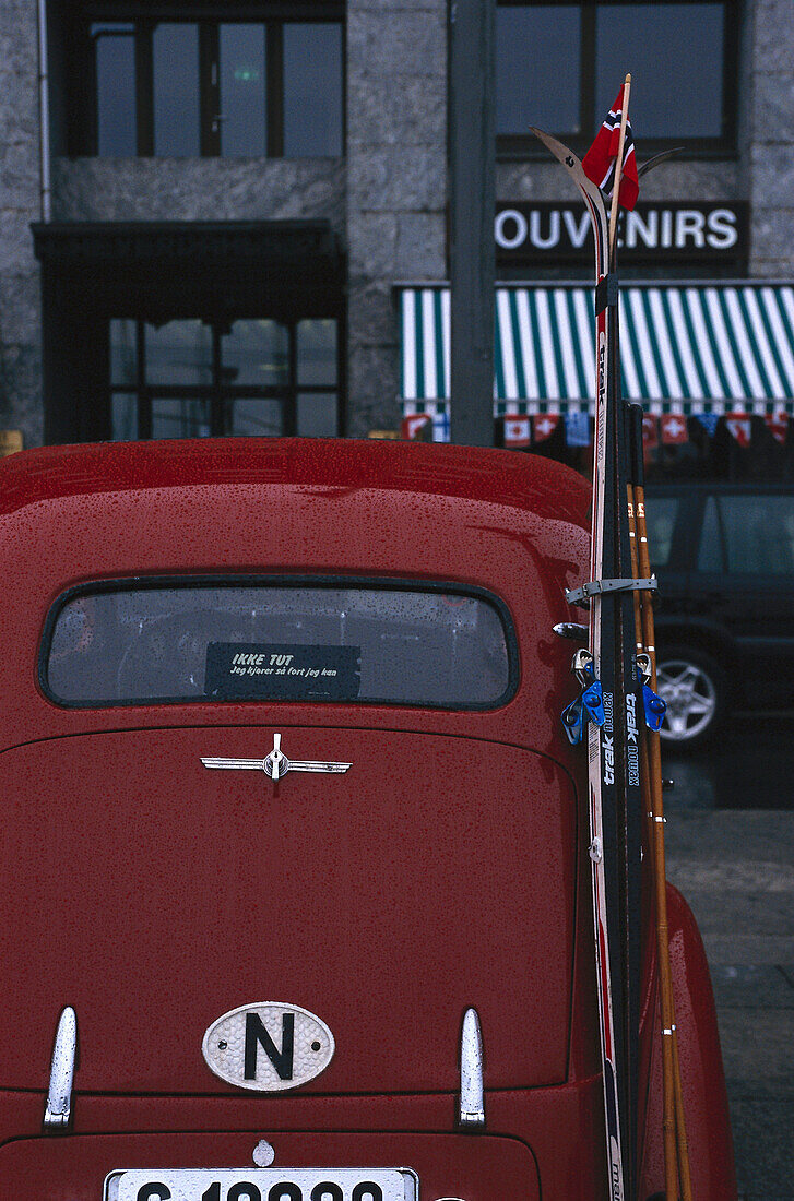 View of a red car with ski from behind, Oslo, Norway