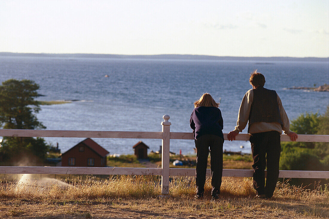 Couple looking at view, Utoe, Archipelago, Sweden