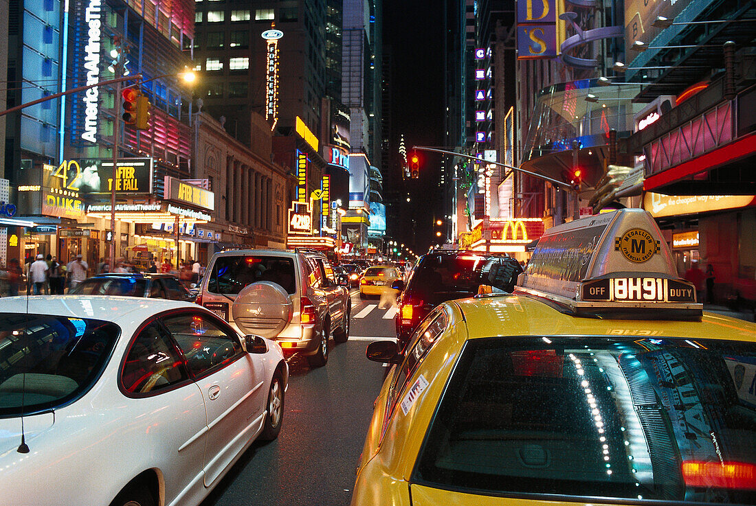 Cars and illuminated advertising at night, 42nd Street &amp;amp;amp; Times Square, Manhattan, New York, USA, America