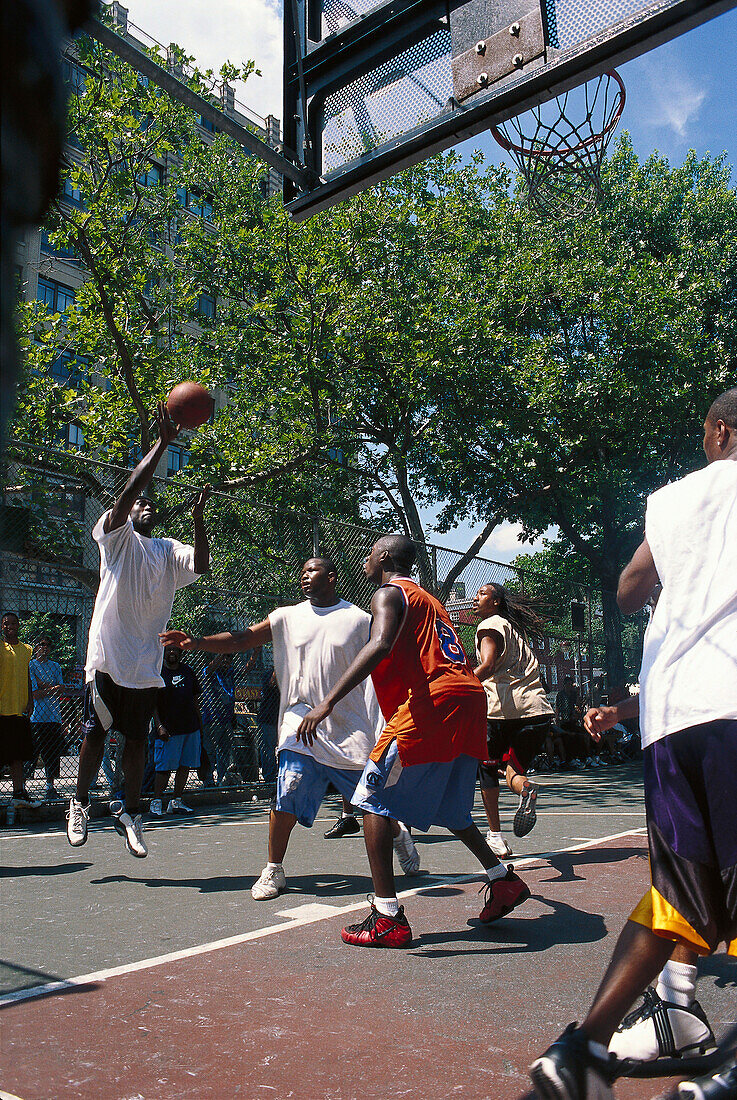 Young men playing basket ball, 6th Avenue, Greenwich Village, Manhattan, New York, USA, America