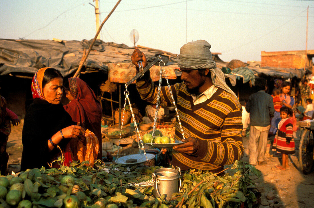 People at the market at a shanty town, New Delhi, India, Asia