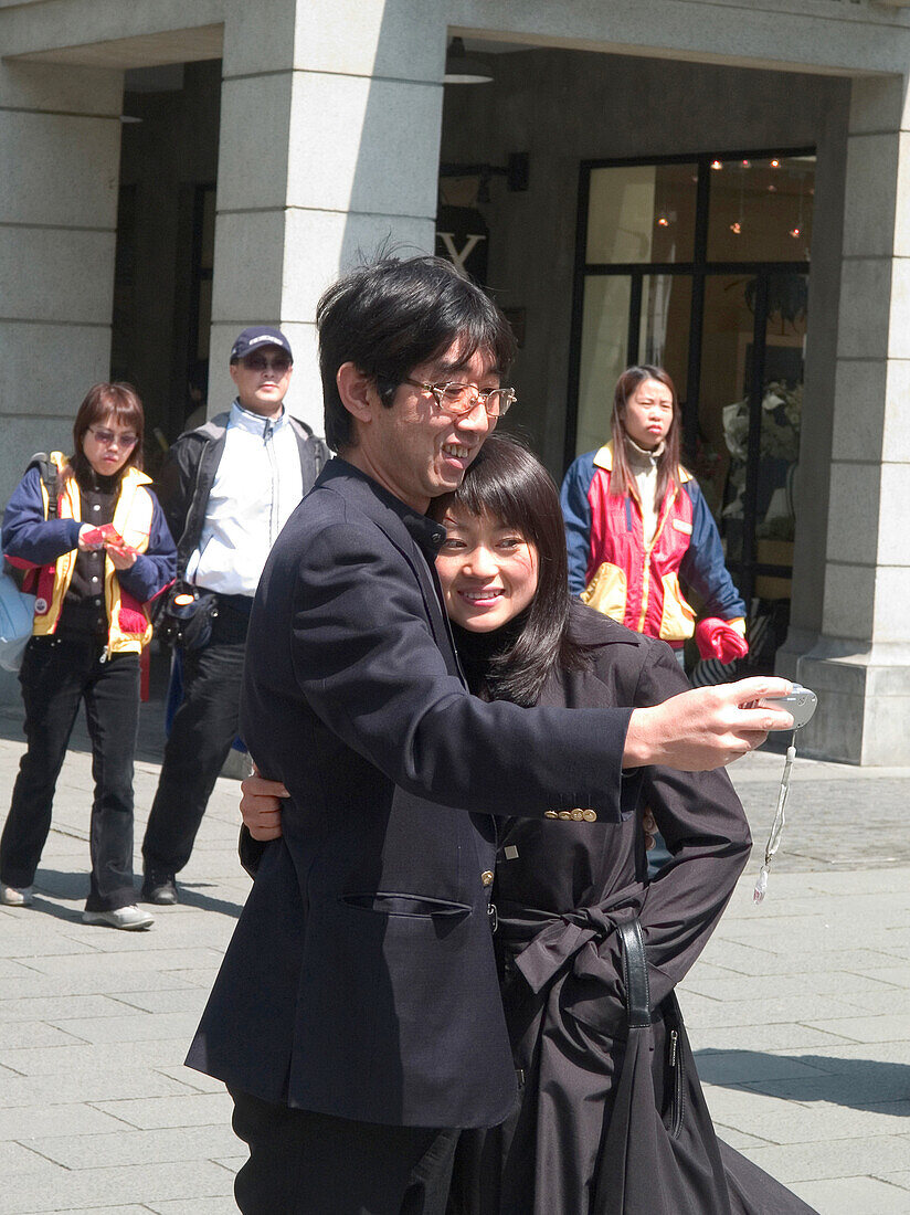 Couple taking photo, Shanghai, China