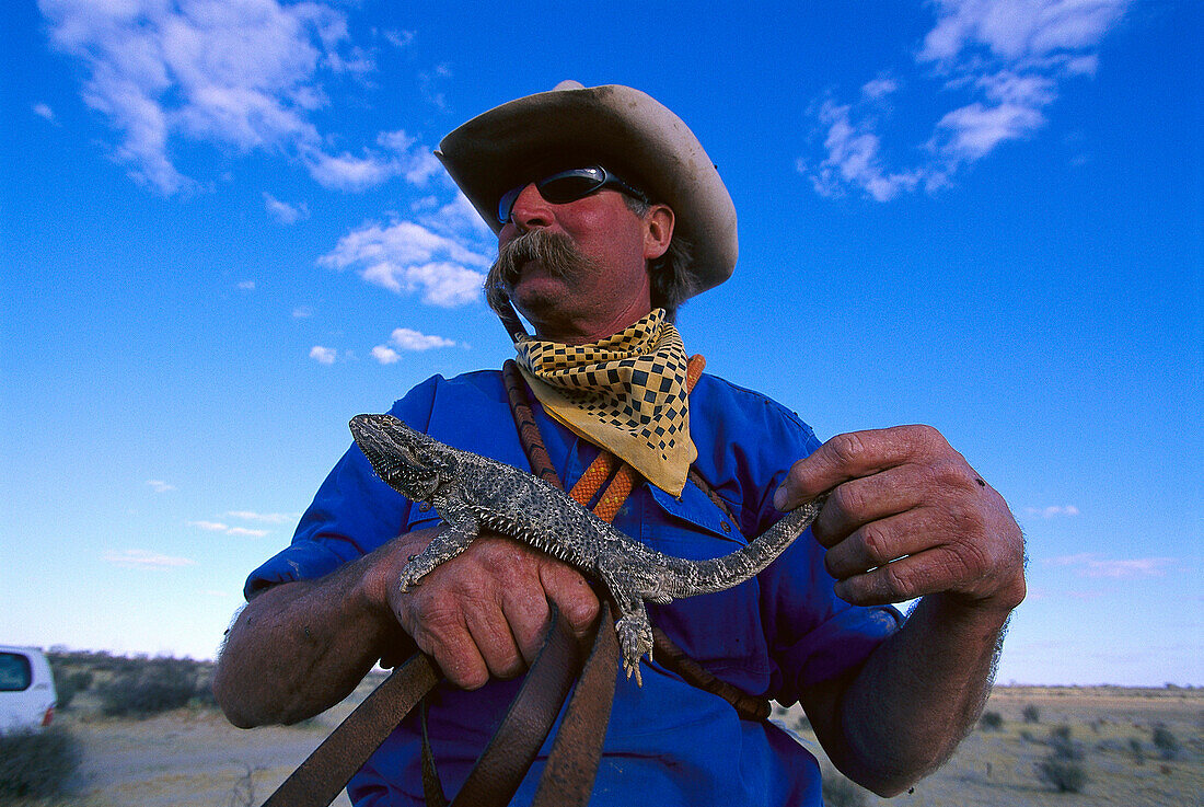 Cowboy with Leguan, Cattle Station, South Australia Australia