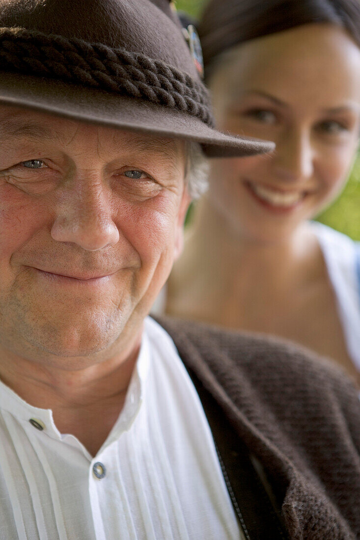 Older Bavarian man and young woman, Munich, Bavaria