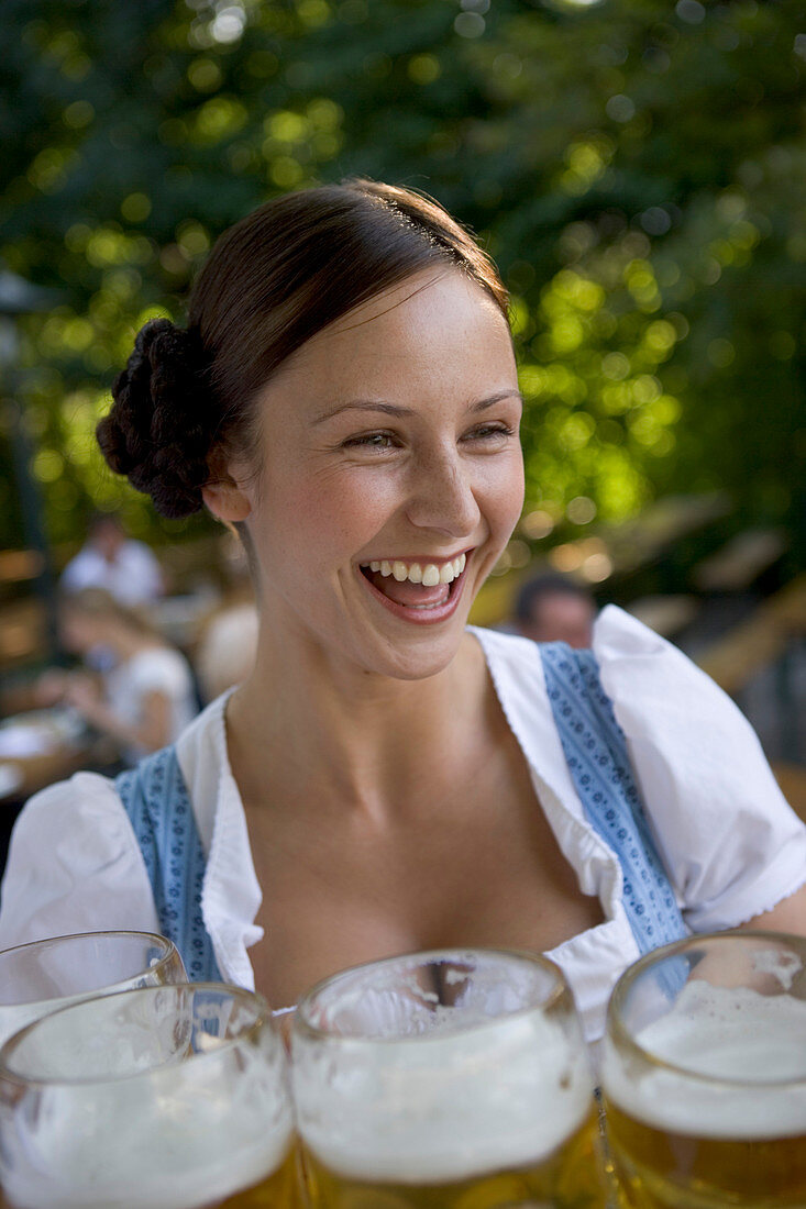 Waitress with beer glasses, Starnberger See Bavaria, Germany