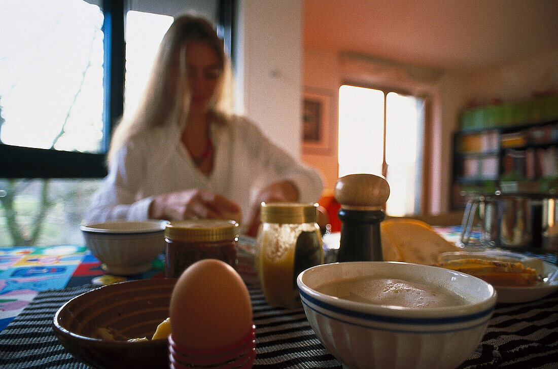 Mid adult woman having breakfast