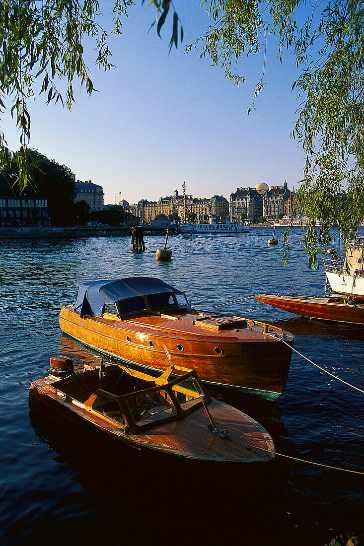 Wooden boats are moored at the island of Skeppsholmen, Stockholm, Sweden, Europe