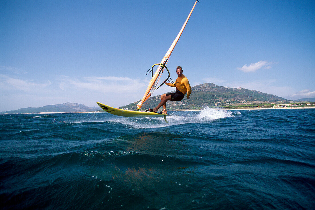 Windsurfer surfing over the sea, Playa Los Lances, Tarifa, Costa de la Luz, Andalusia, Spain