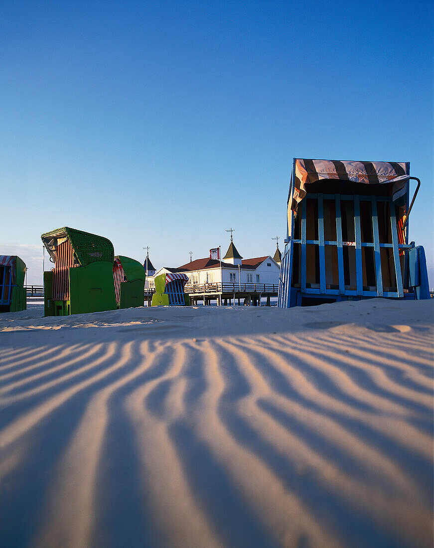 Beach chairs at the deserted beach under blue sky, Ahlbeck, Usedom Island, Mecklenburg Western Pomerania, Germany