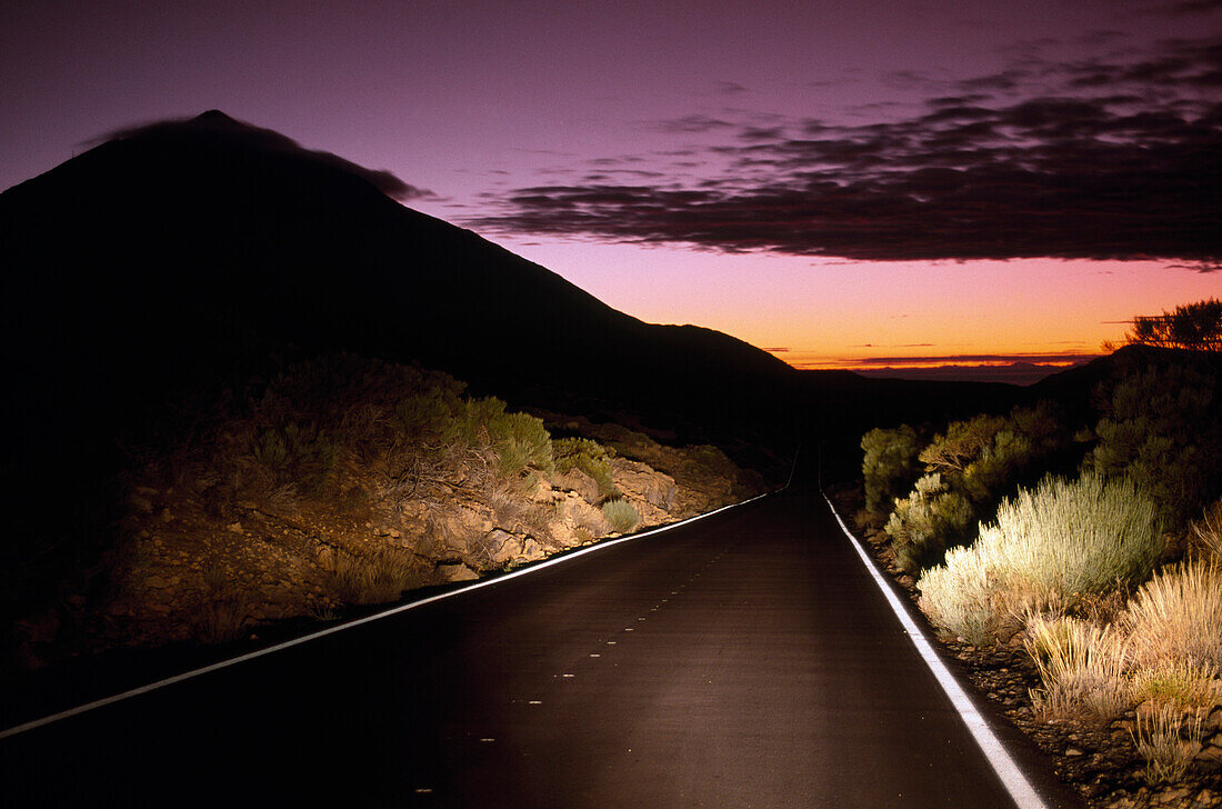 A road and the mountain Pico del Teide at dusk, Canadas National Park, Tenerife, Canary Islands, Spain