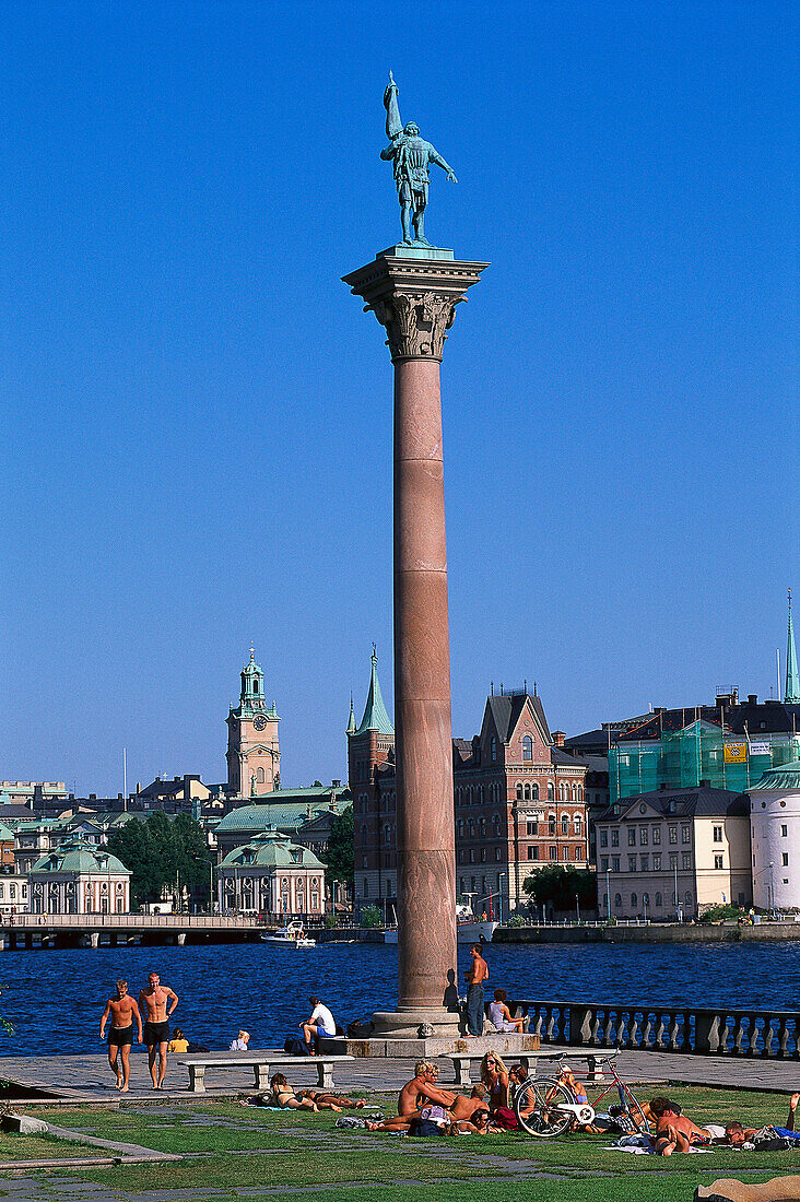 Column with statue in front of Riddarholmen under blue sky, Stockholm, Sweden, Europe