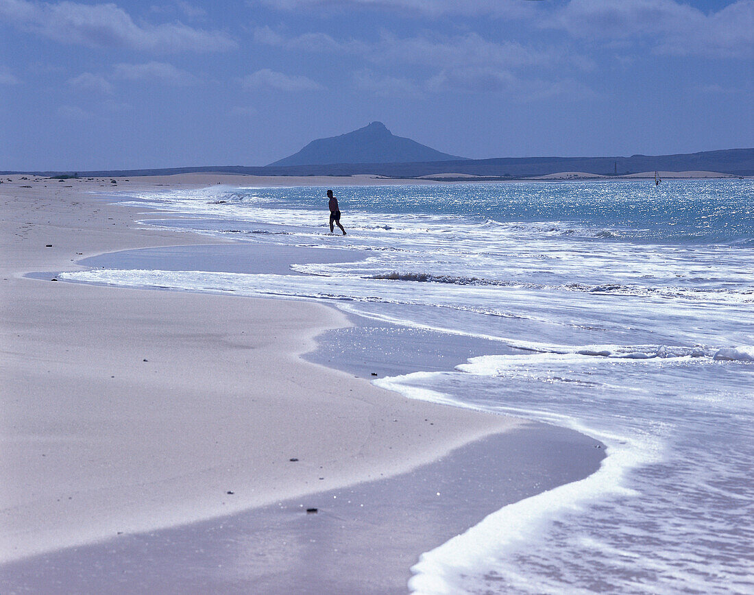 One person coming out of the water to the sandy beach, Praia de Chave, Boavista, Cape Verde, Africa