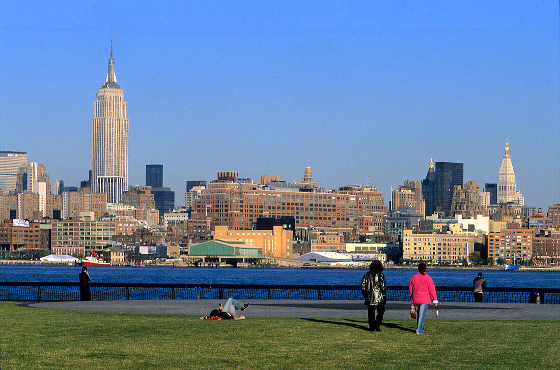 People at the Hudson River Park in the sunlight, Hudson River, Manhattan, New York, USA, America