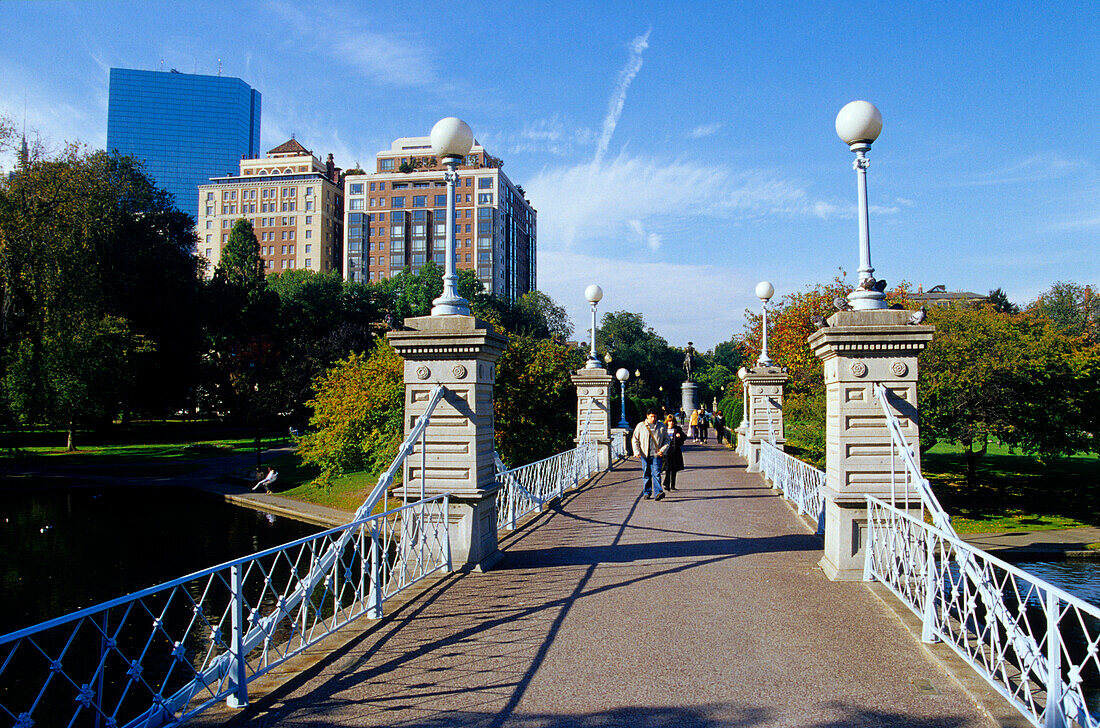 People on the Lagoon Bridge at a park in the sunlight, Boston, Massachusetts, USA, America