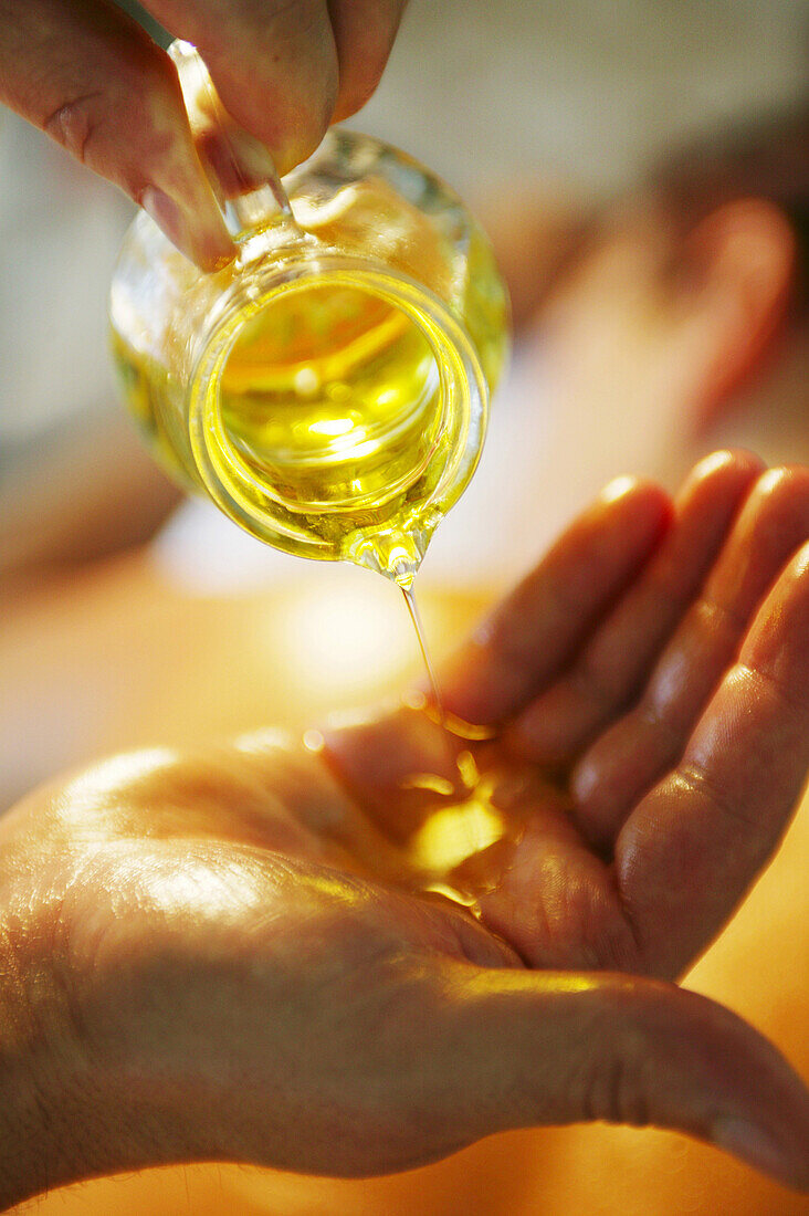 Pouring oil in hands