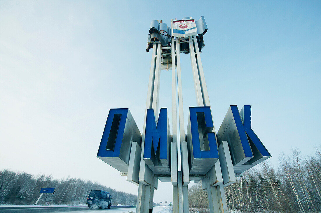 Place-name sign at the roadside Omsk, Siberia