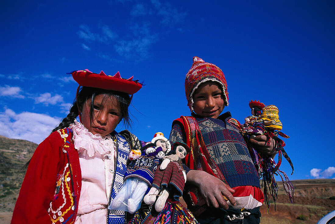 Indian children playing with dolls, brother and sister, Peru, South America