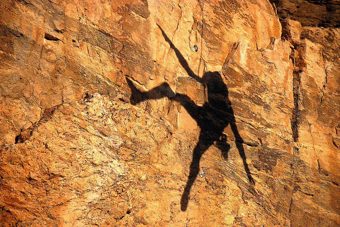 Shadow of a man abseiling, Free climbing, Arizona, USA