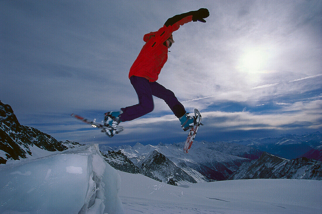 Jump with snow shoes, Hohe Tauern, Salzburger Land, Austria