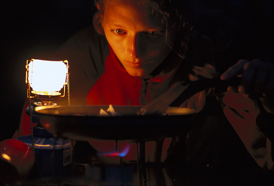 Woman is cooking, Camping, South Africa