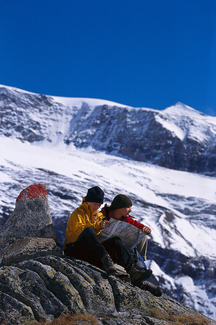 Two hikers consulting the map, Dorfertal, Hohe Tauern, Austria