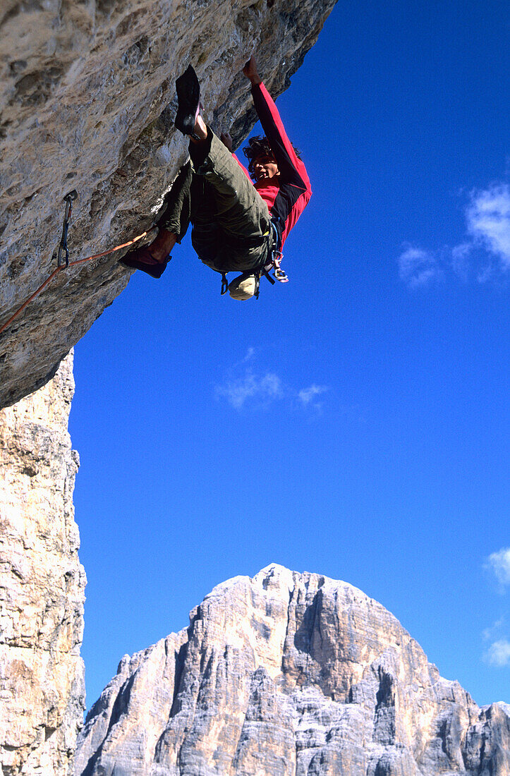 Male rock climber at Cinque Torre, Cortina d'Ampezzo, Dolomites, South Tyrol, Italy
