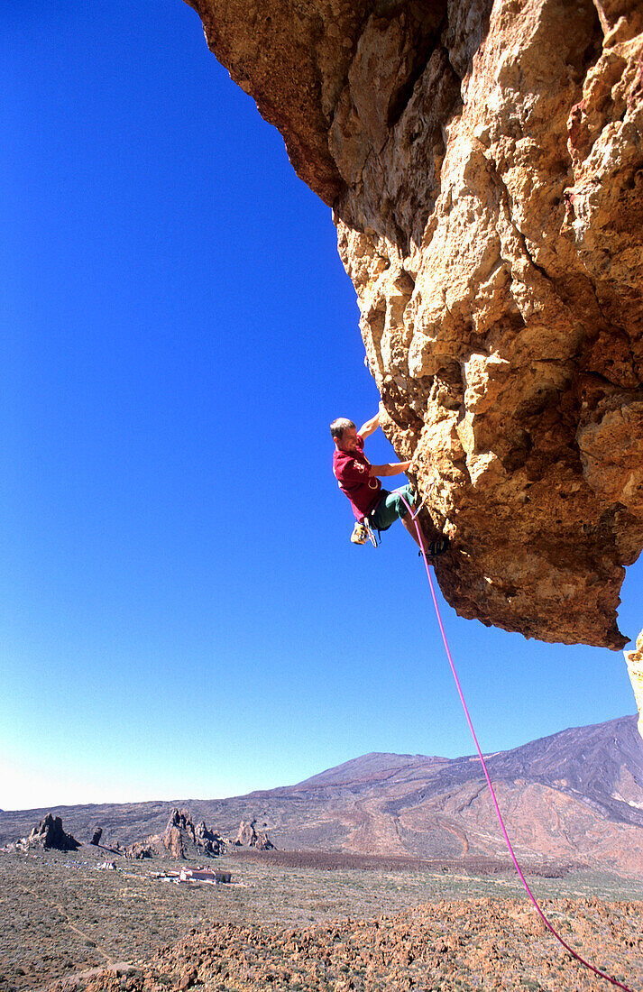 Male rock climber, Las Canadas, Tenerife, Canary Islands, Spain