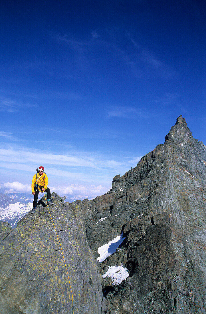 Climber on ridge on top of mountain, Hohe Tauern, Salzburger Land, Austria