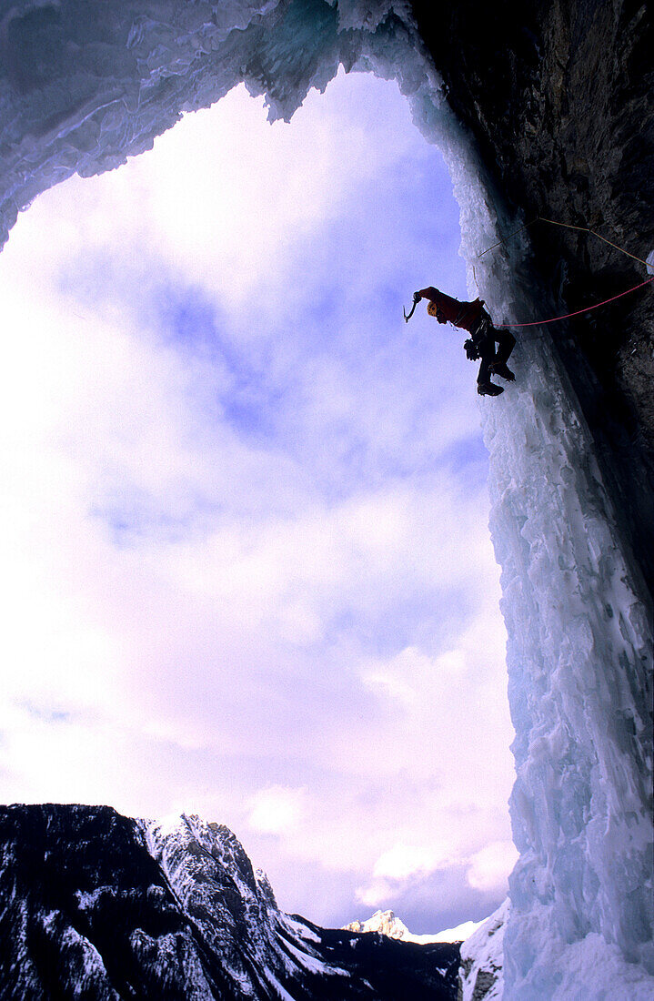 Harald Berger ice climbing up an ice Cave, Mixed Climbing, Pilsner, Golden Area, M7, Banff National Park, Alberta, Canada
