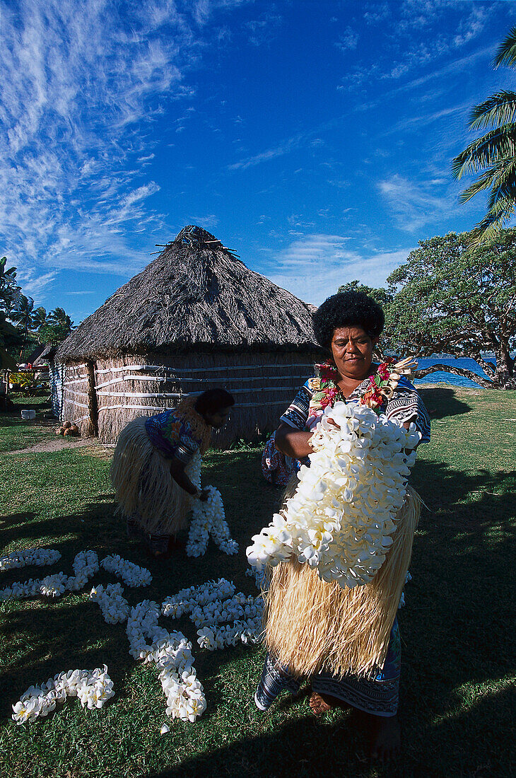 Navotua Villagers with flowers, Blue Lagoon Cruise Nacula Island, Yasawa, Fiji