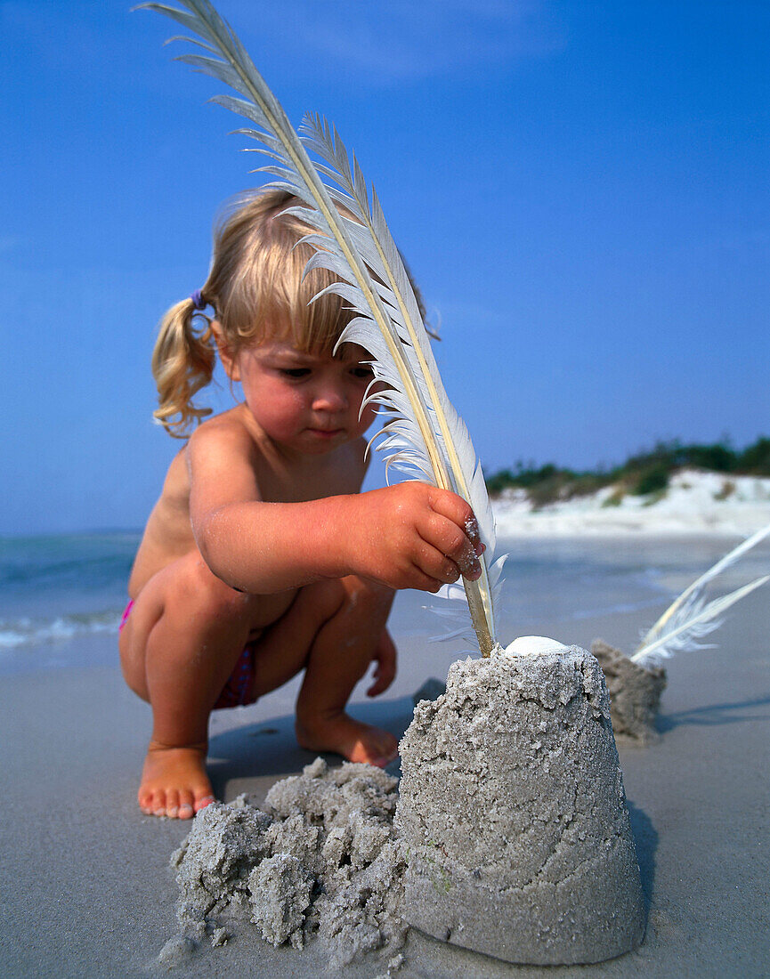 Girl playing on the beach, Dueodde, Bornholm, Baltic Sea, Denmark