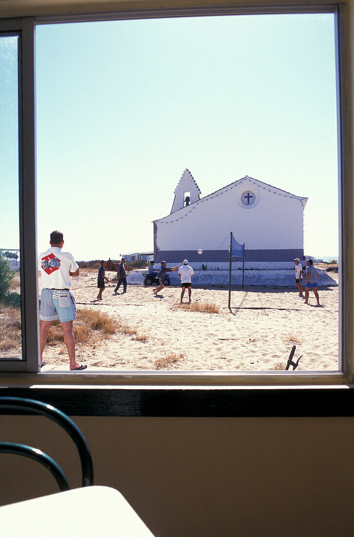 Fishermen playing volley ball, Parque Natural da Ria Formosa East Algarve, Portugal