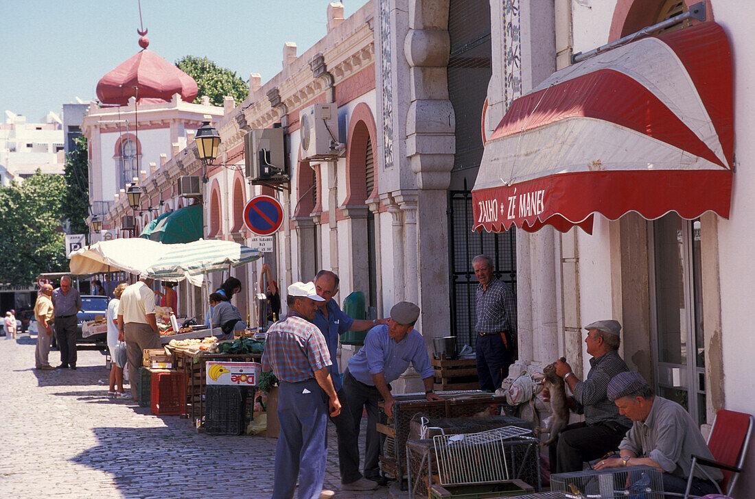 People at stands in front of the market hall, Loulé, Faro, Algarve, Portugal, Europe